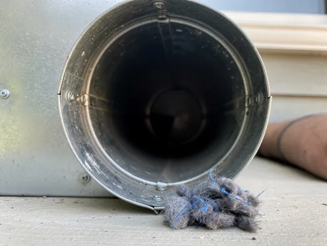 Alhambra Dryer Vent Cleaning technician using specialized equipment to clear severe dryer vent blockage in Alhambra